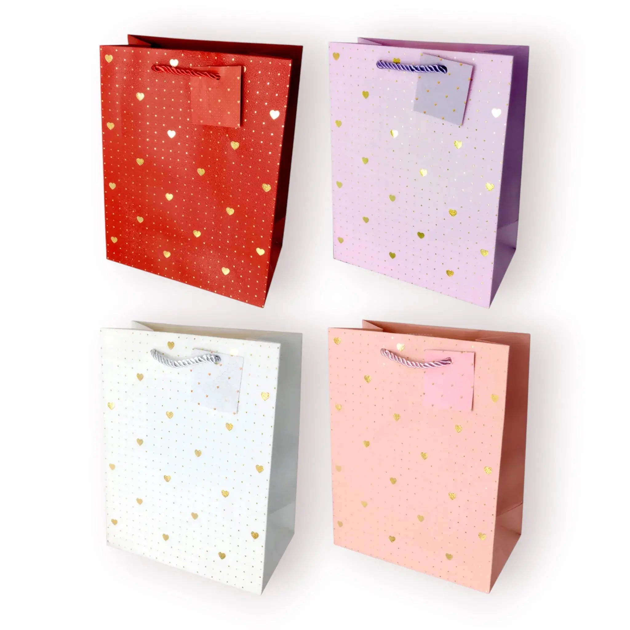 Bolsa de regalo mediana con estampado de corazones dorados metalizados sobre fondos pastel.