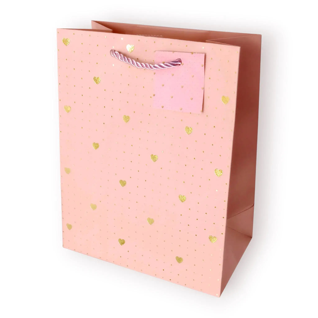 Bolsa de regalo mediana con estampado de corazones dorados metalizados sobre fondos pastel.