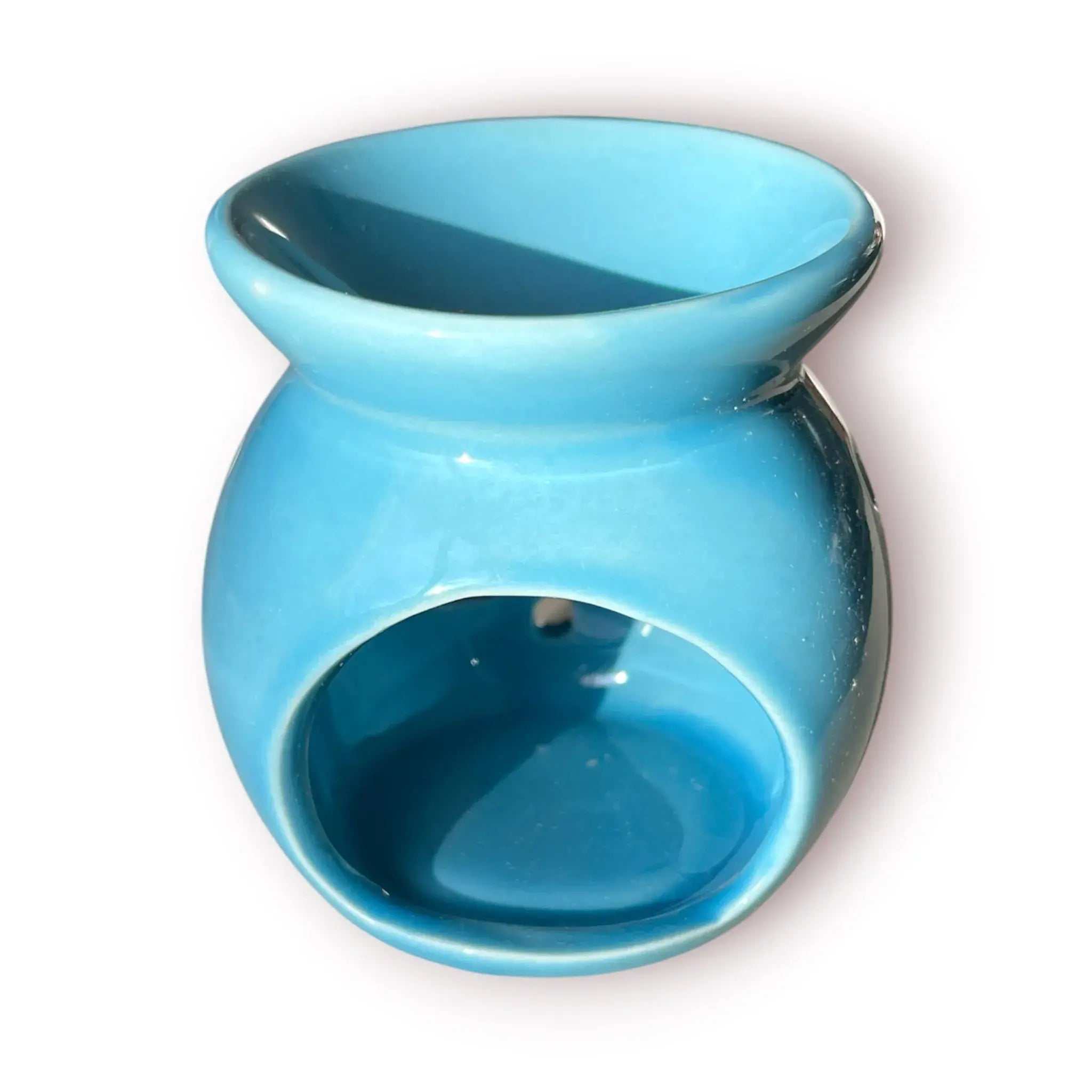 Difusor aromático de cerámica esmaltada modelo clásico para esencias y velas de té, disponible en colores blanco, rosado y azul celeste.