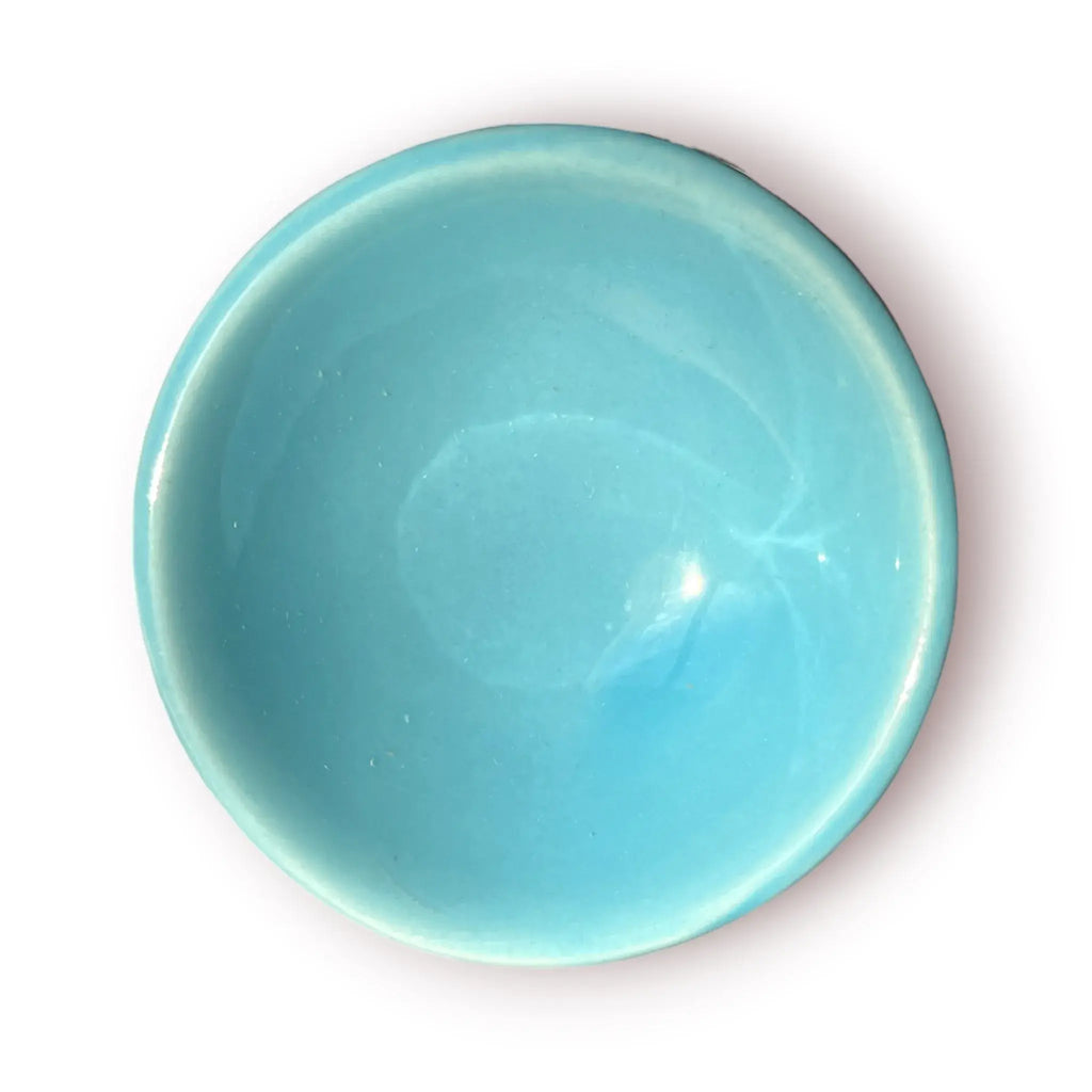 Difusor aromático de cerámica esmaltada modelo clásico para esencias y velas de té, disponible en colores blanco, rosado y azul celeste.