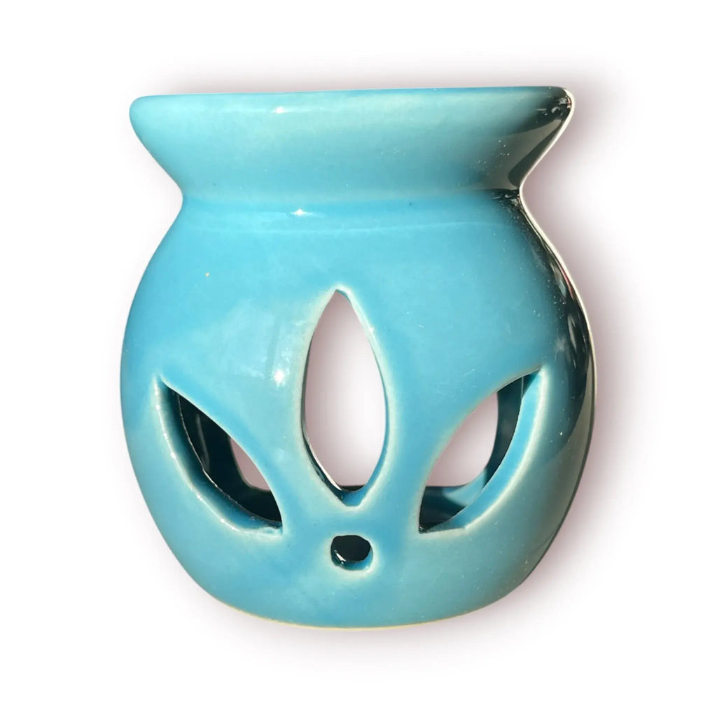Difusor aromático de cerámica esmaltada modelo clásico para esencias y velas de té, disponible en colores blanco, rosado y azul celeste.