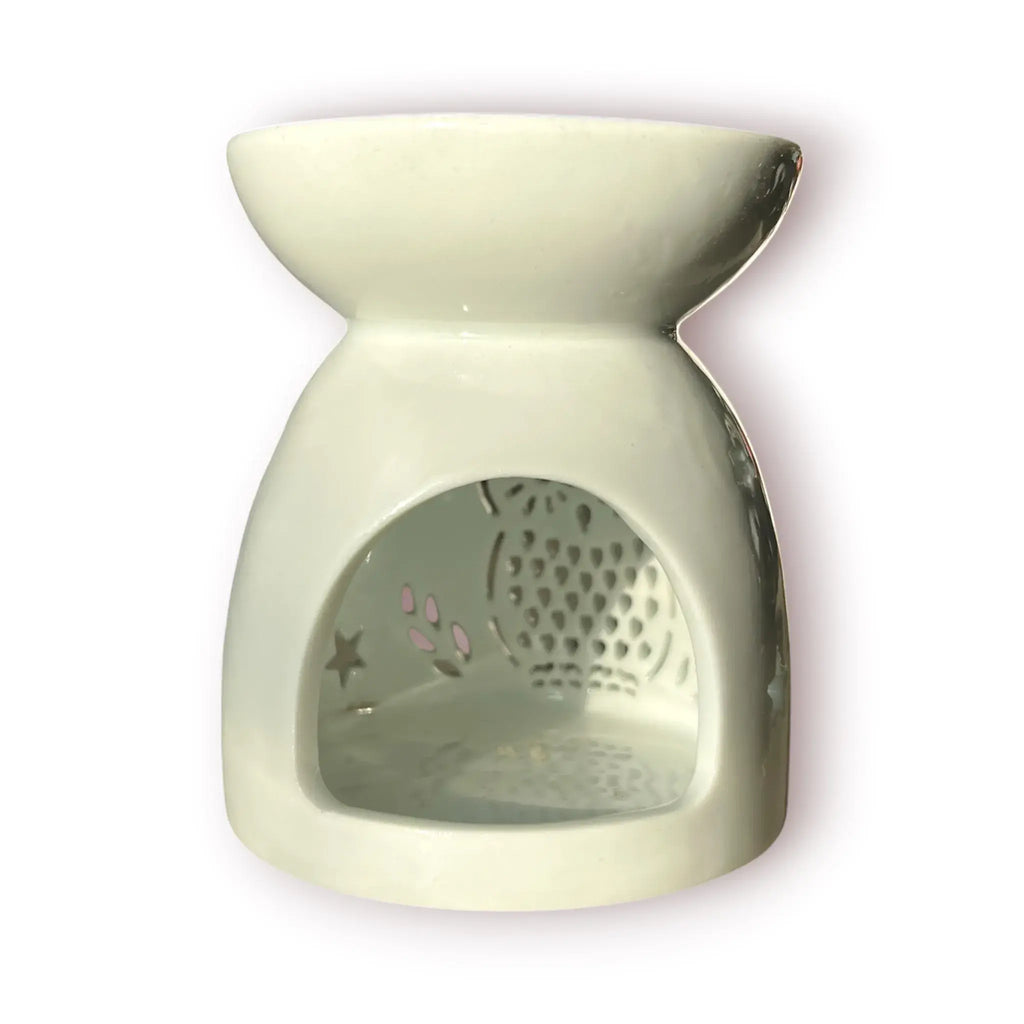 Difusor aromático de cerámica esmaltada color blanco con calados decorativos en forma de búho y estrellas para velas de té.