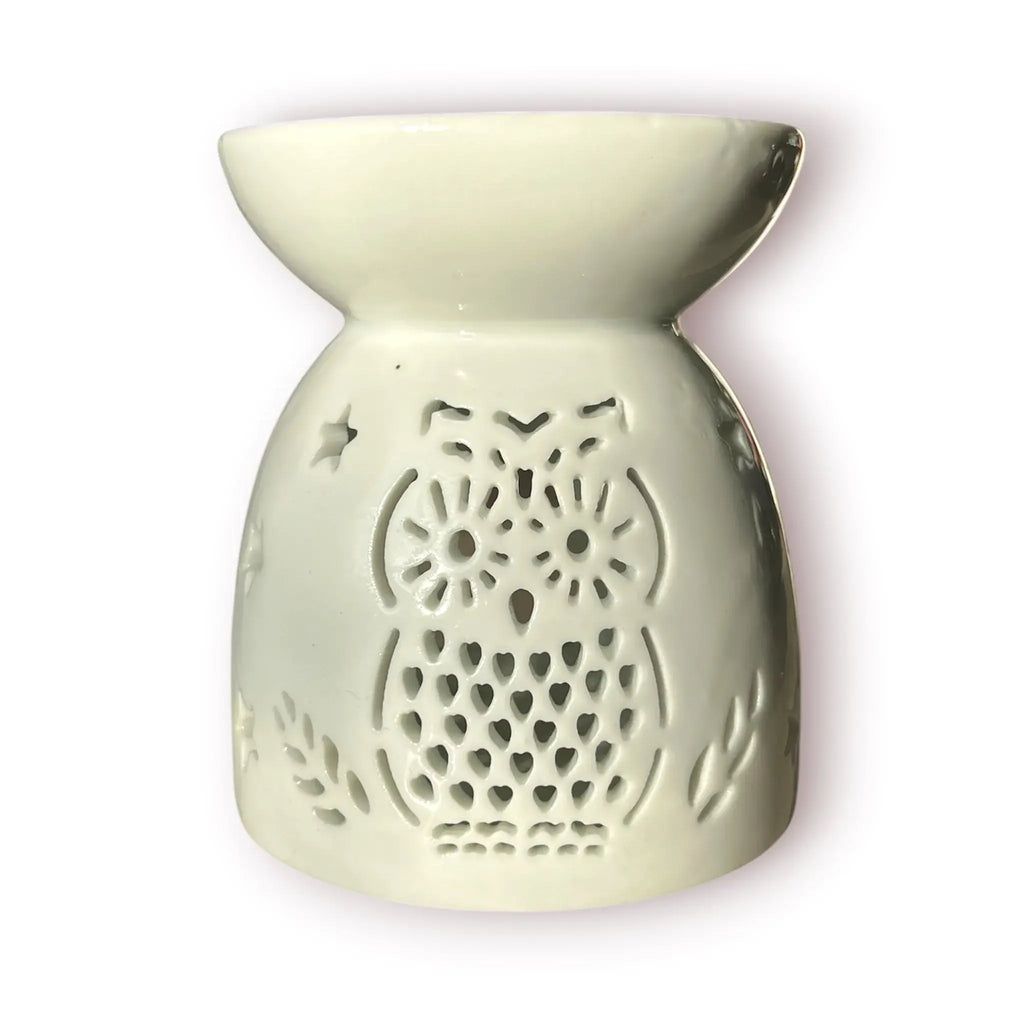Difusor aromático de cerámica esmaltada color blanco con calados decorativos en forma de búho y estrellas para velas de té.