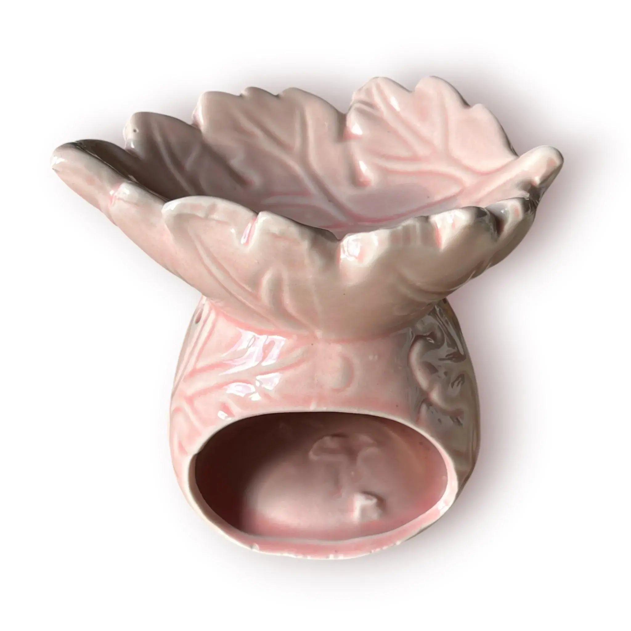 Difusor aromático de cerámica esmaltada con relieve e ingenioso cuenco en forma de hoja, disponible en colores rosado pastel y café.