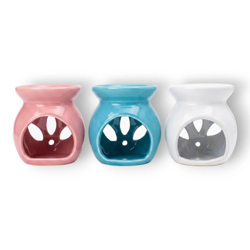 Difusor aromático de cerámica esmaltada modelo clásico para esencias y velas de té, disponible en colores blanco, rosado y azul celeste.